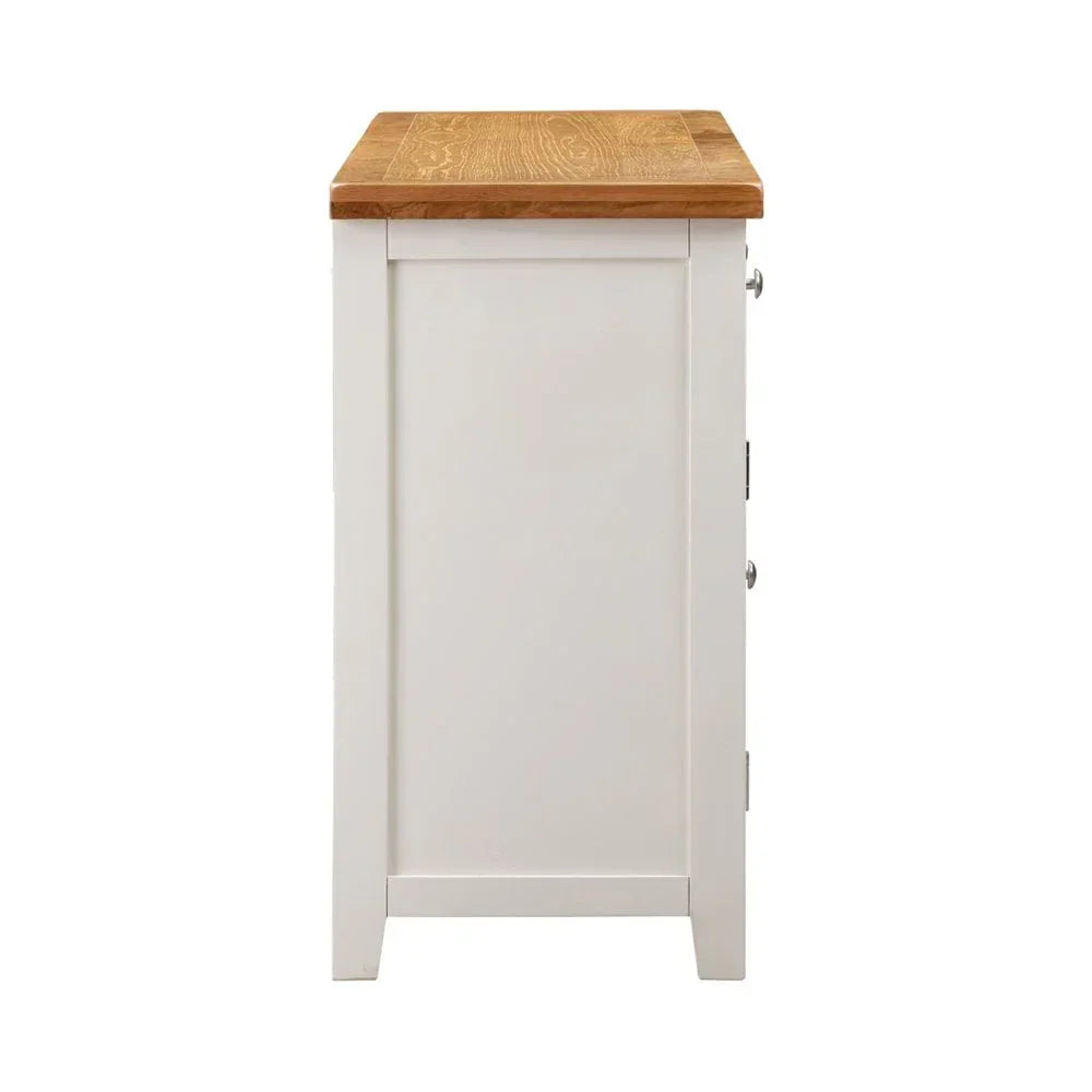 Side view of white painted wooden sideboard with oak top and panel detailing