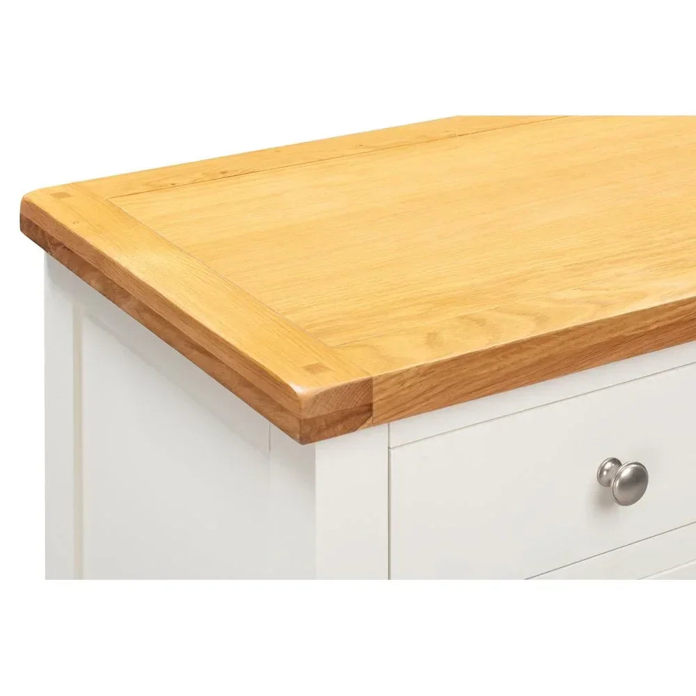 Oak top white chest of drawers with metal knob handle, close side angle view