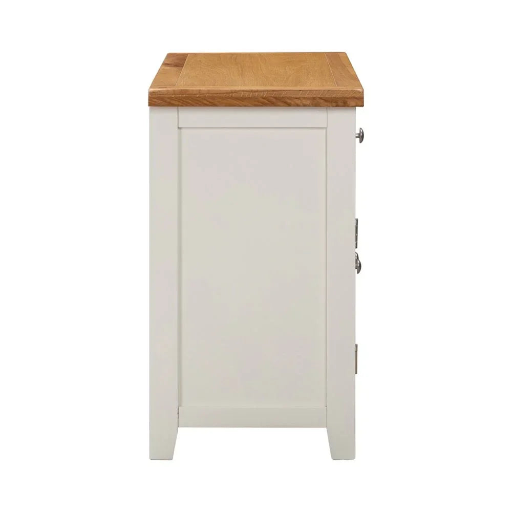 Side view of cream painted sideboard with natural oak top and panel detailing