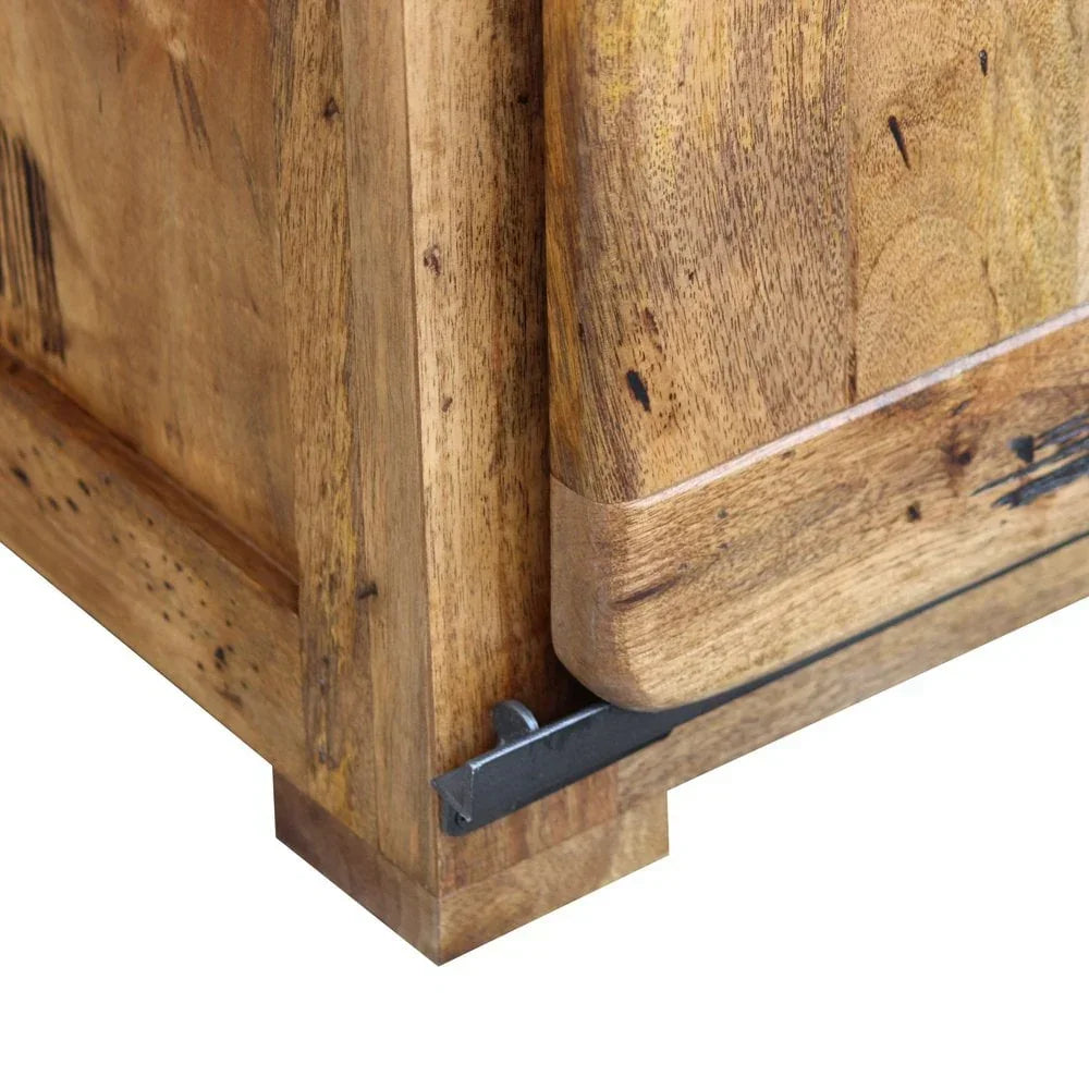 Corner detail of solid wood sideboard with black metal accent and natural grain finish