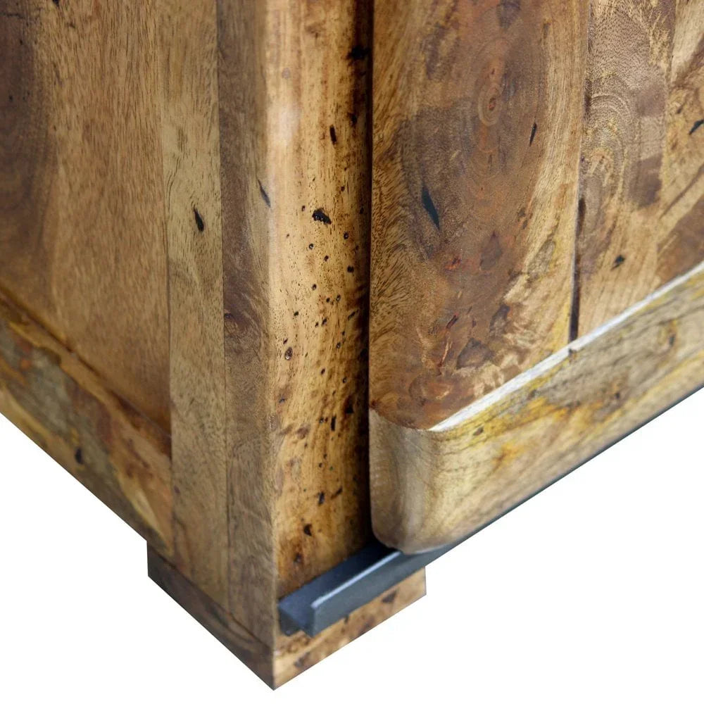 Close-up of wooden sideboard corner with natural grain and chunky leg detail