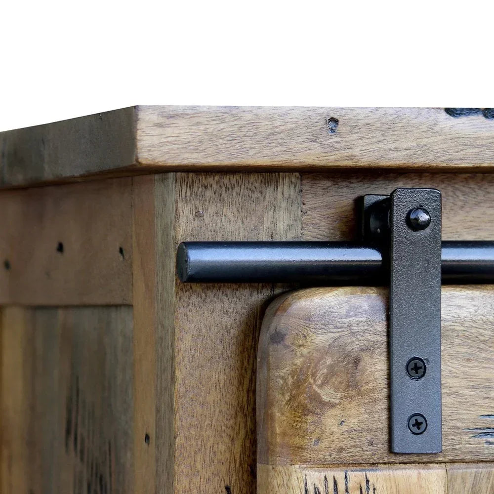 Close view of wood cabinet with black metal sliding barn door hardware