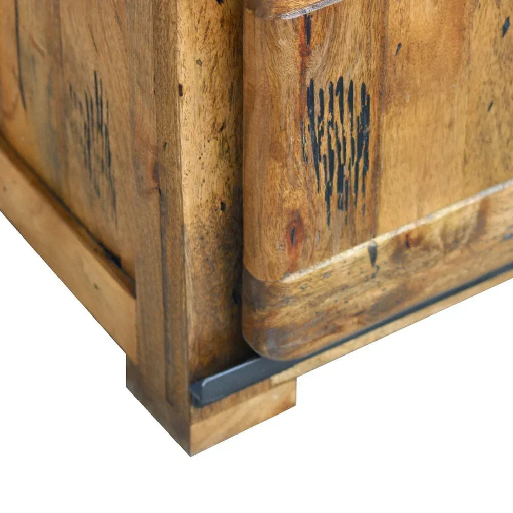 Closeup of natural wood grain sideboard corner with black accents and rustic finish