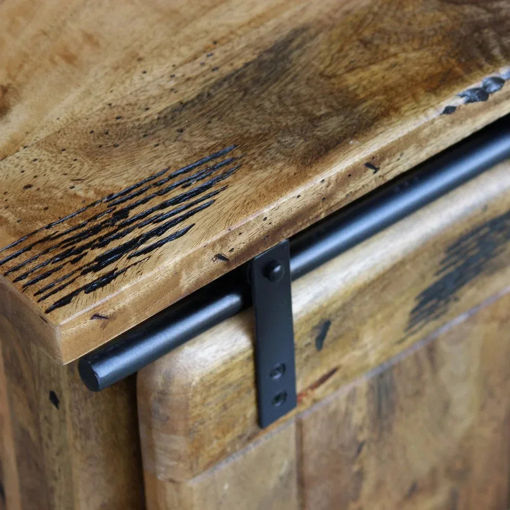 Close-up of rustic wooden sideboard top with black metal sliding door rail