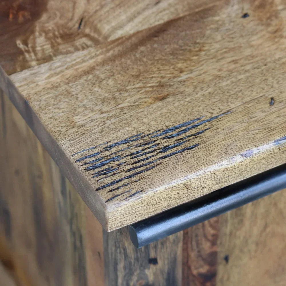Close-up of solid wood furniture corner with metal handle and natural grain detail