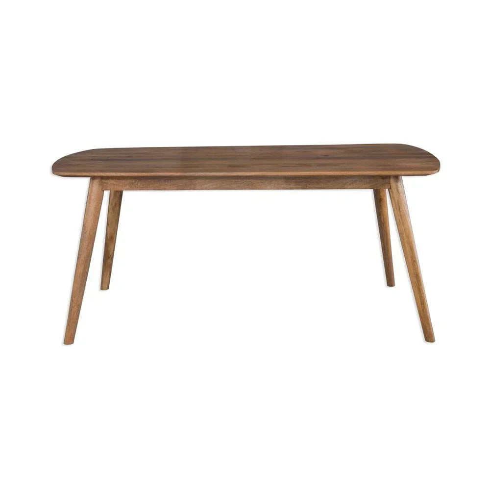 Rectangular wooden dining table with rounded edges and angled legs on white background