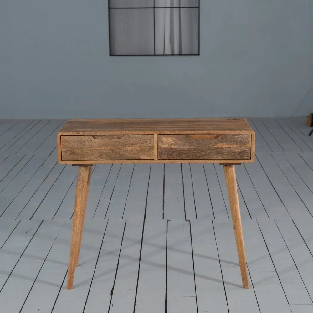 Solid wood console table with two drawers and tapered legs on painted floor