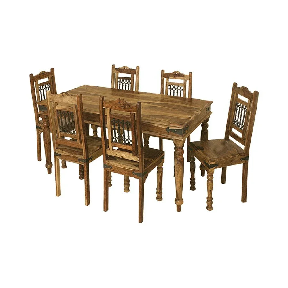 Rustic wooden dining table set with six matching chairs and carved chair backs