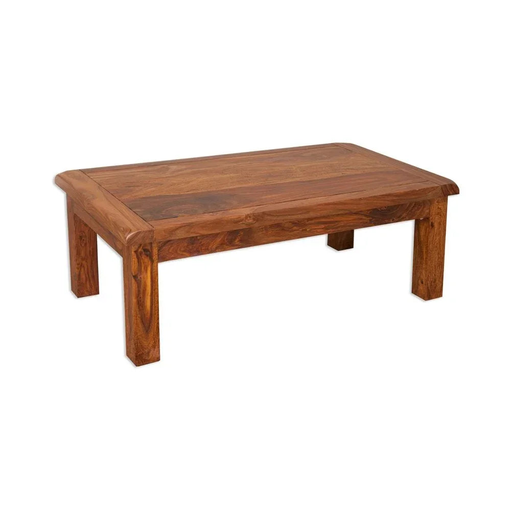 Solid wood coffee table with rectangular top and sturdy block legs, natural wood grain finish