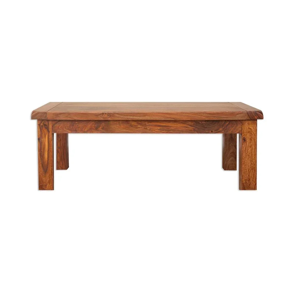 Solid wood coffee table with rectangular top and four sturdy legs, natural wood grain visible