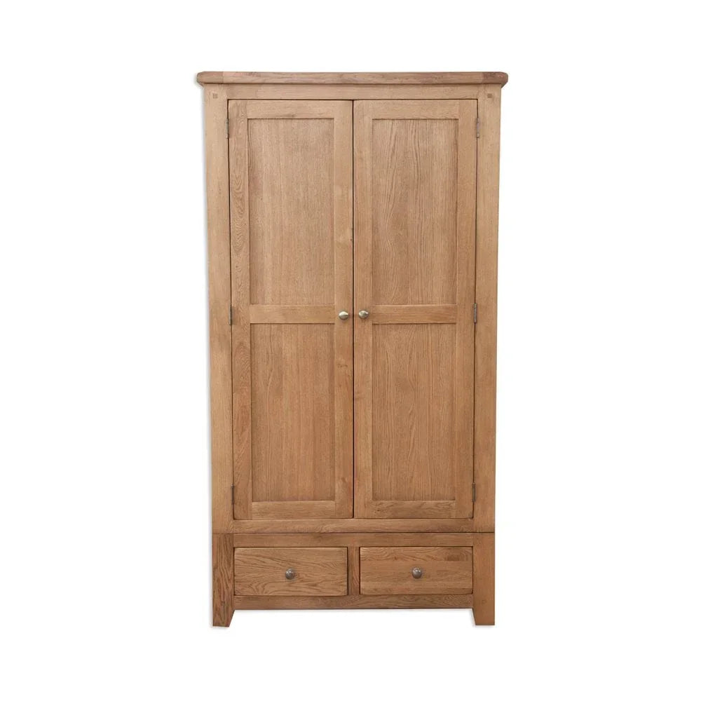 Oak wardrobe with two paneled doors and two lower drawers, front view on white background