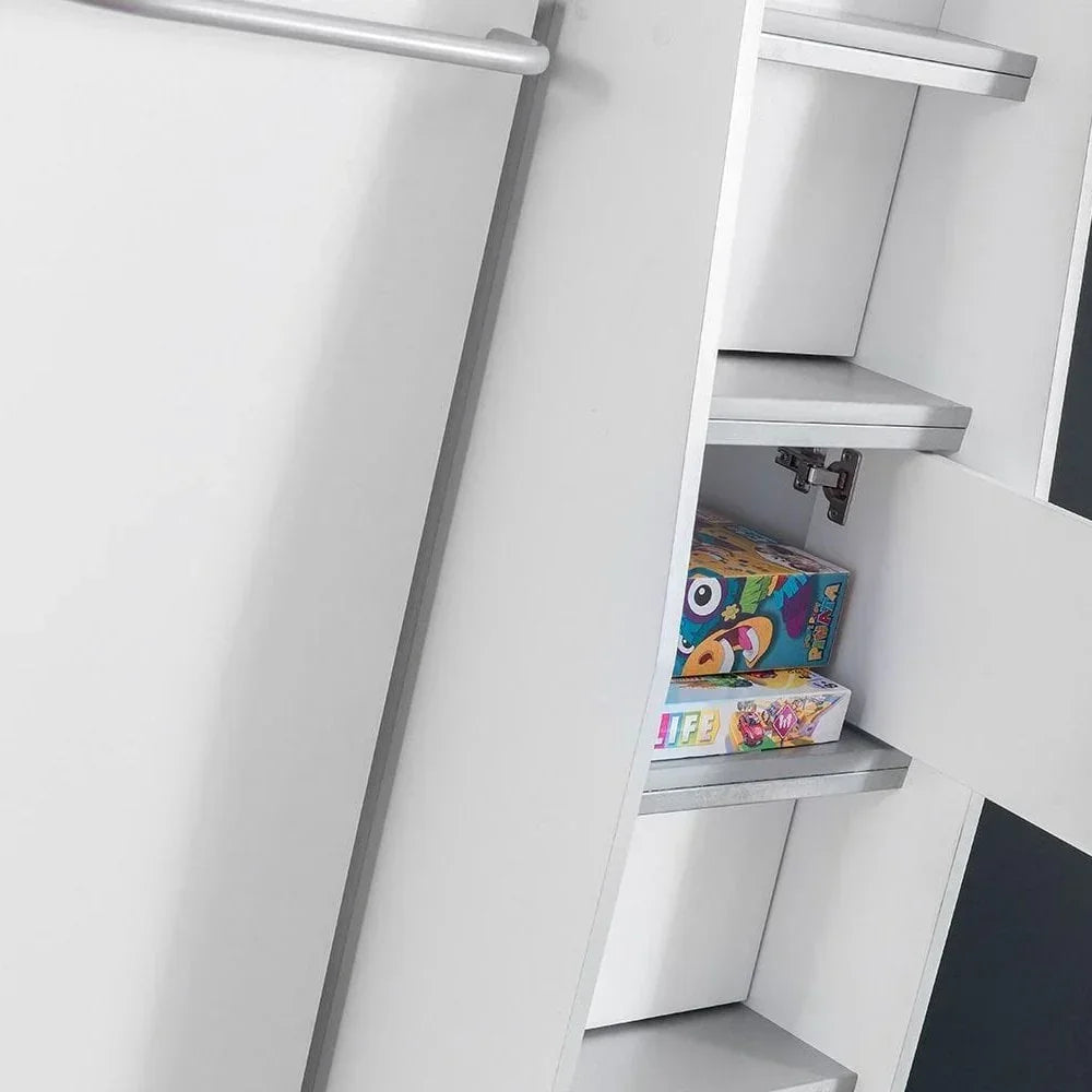 Closeup of white storage cabinet with open door and shelves holding board games