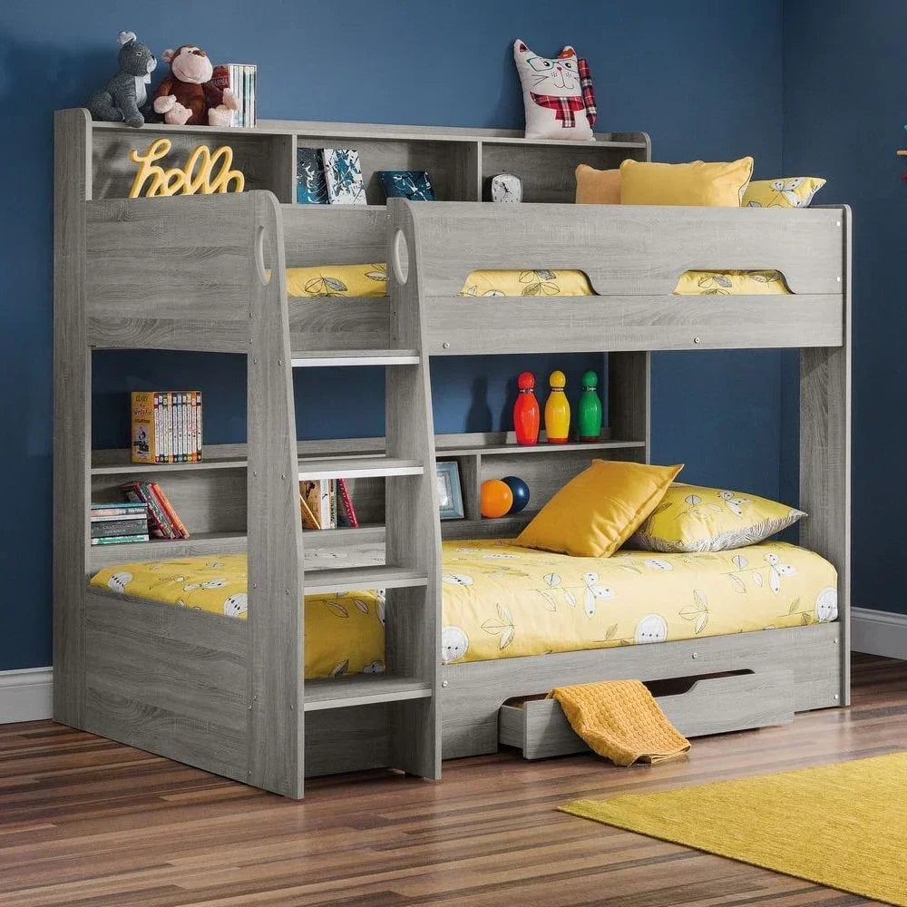 Grey wooden bunk bed with shelving, yellow bedding, and built-in ladder in kids’ bedroom