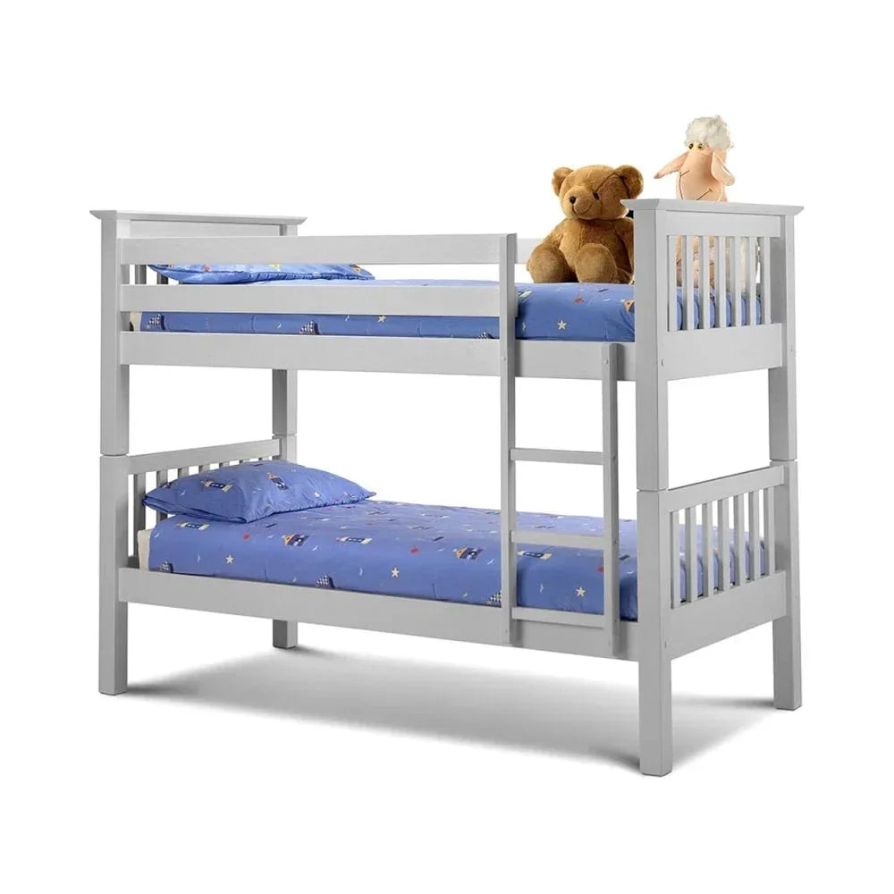White wooden bunk bed with ladder, blue bedding and soft toys on top mattress