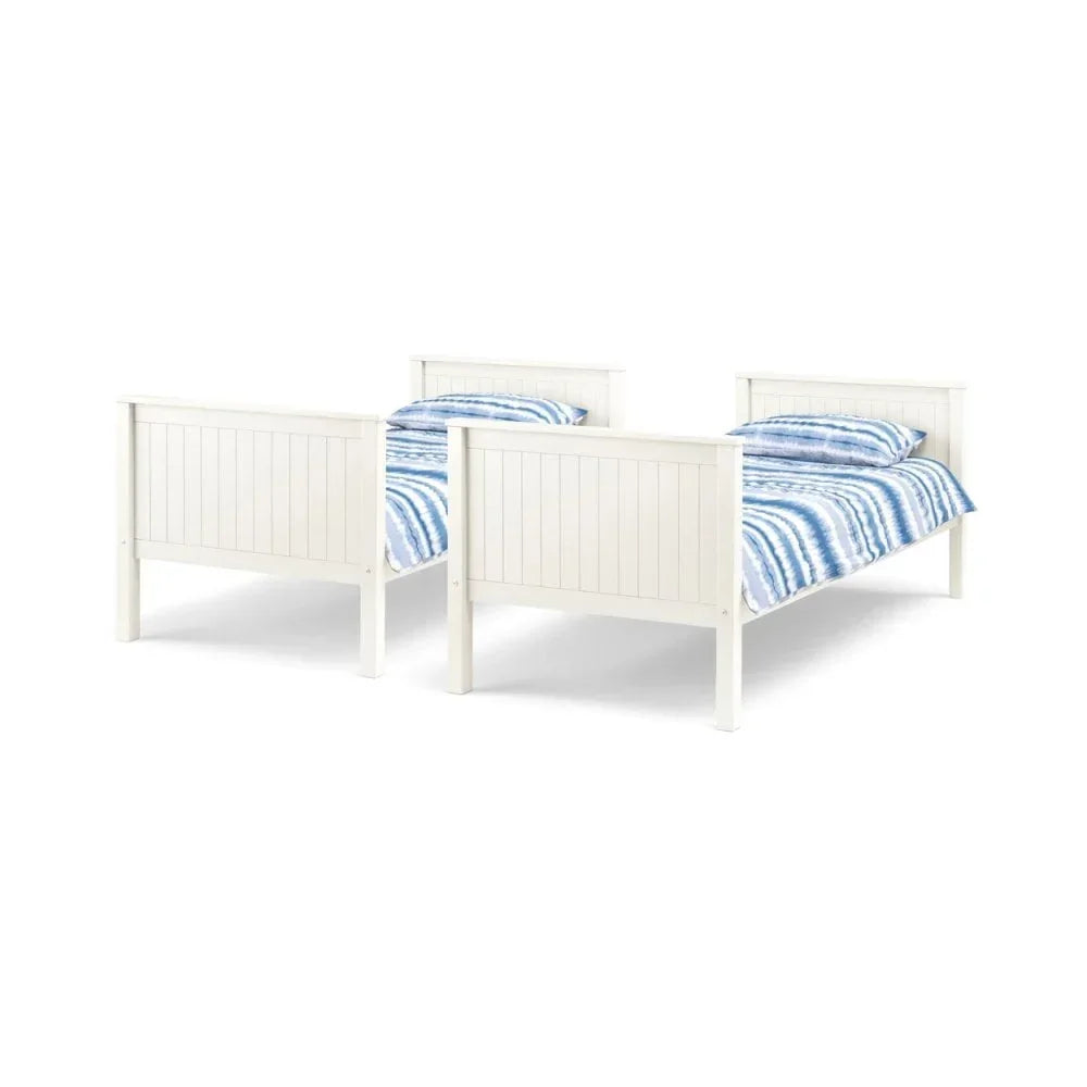 White wooden single beds with blue striped bedding, side by side on white background
