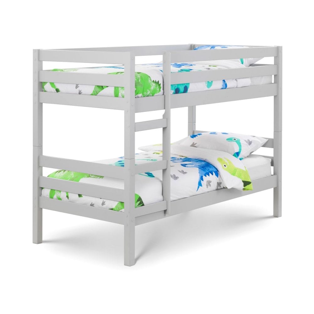 White wooden bunk bed with dinosaur print bedding and safety rails