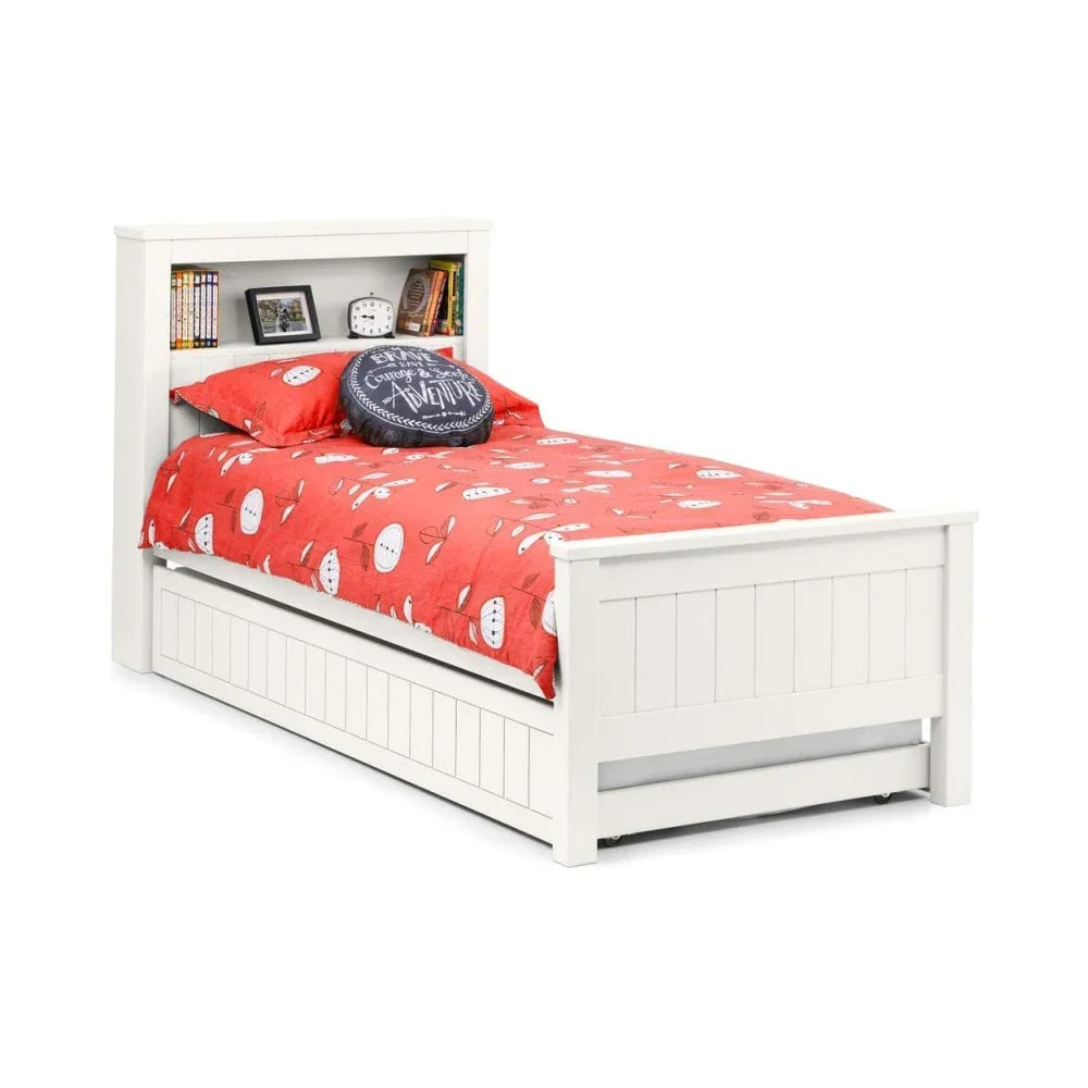 White wooden single bed with bookcase headboard and red bedding, trundle drawer beneath