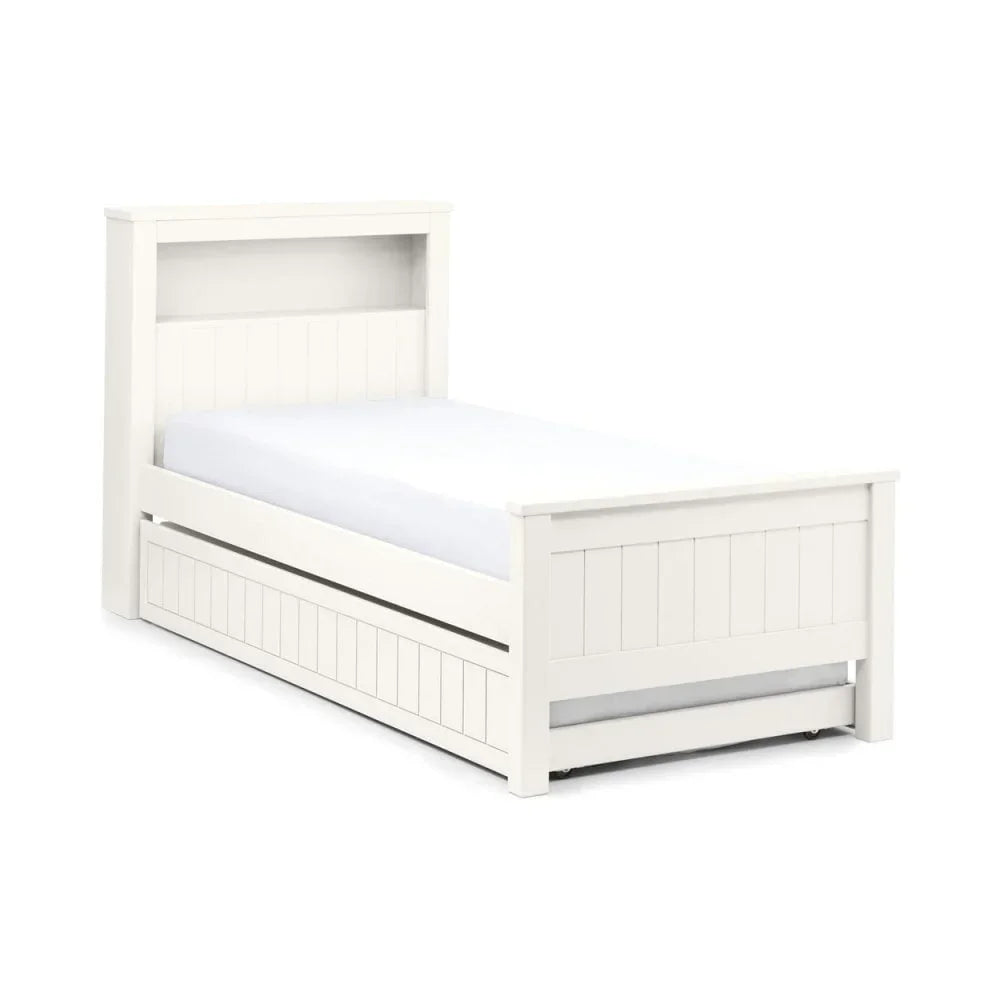 White wooden single bed with bookcase headboard and pull-out trundle drawer