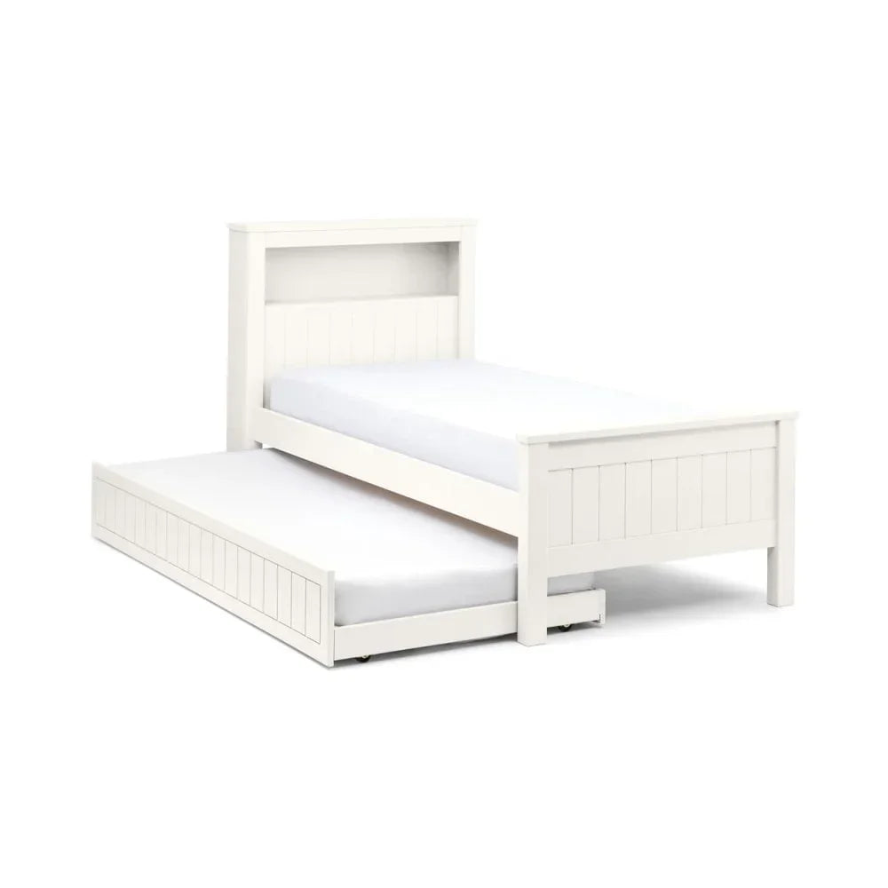 White wooden trundle bed frame with pull-out guest bed and panelled headboard