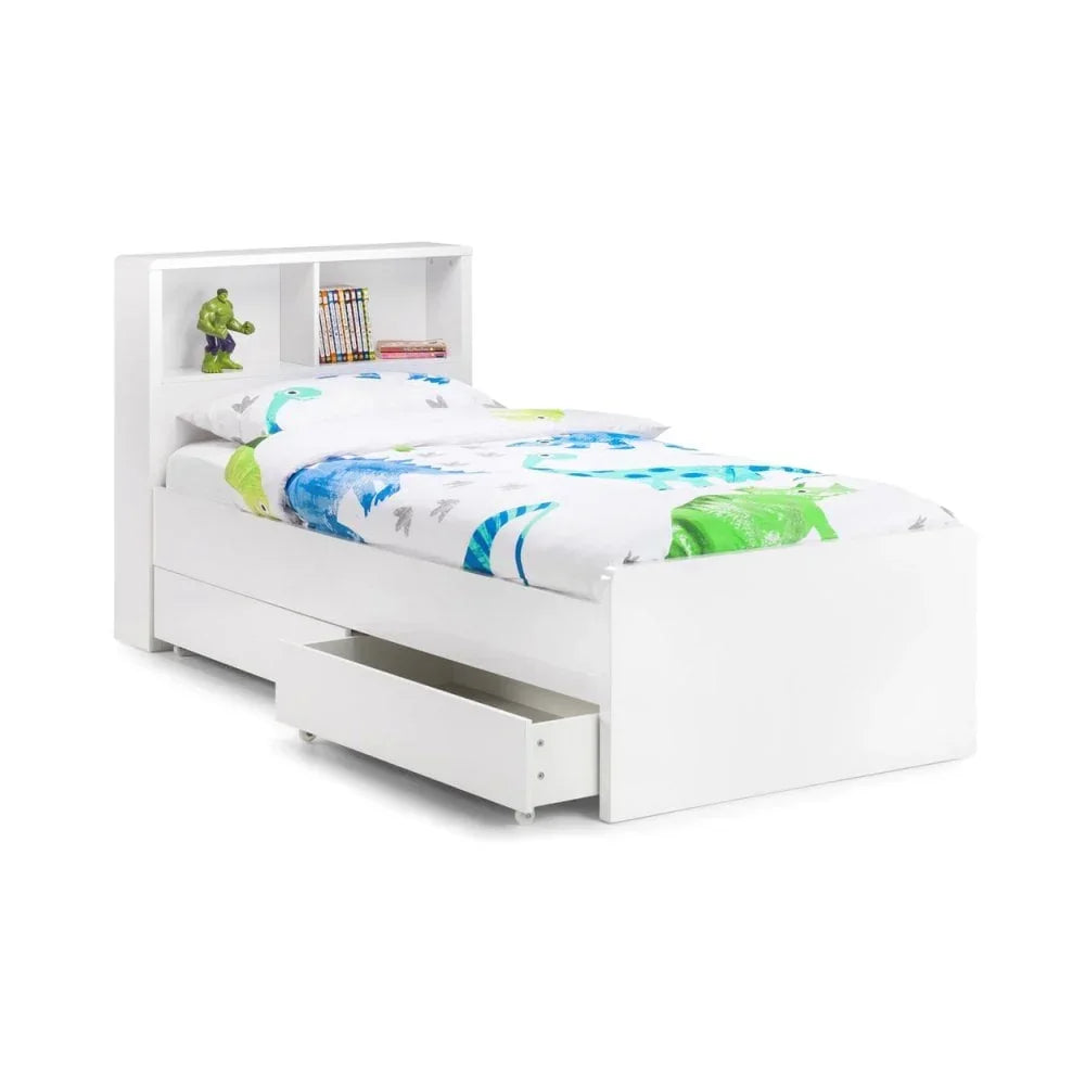 White single bed with storage drawers and shelf headboard, dinosaur bedding