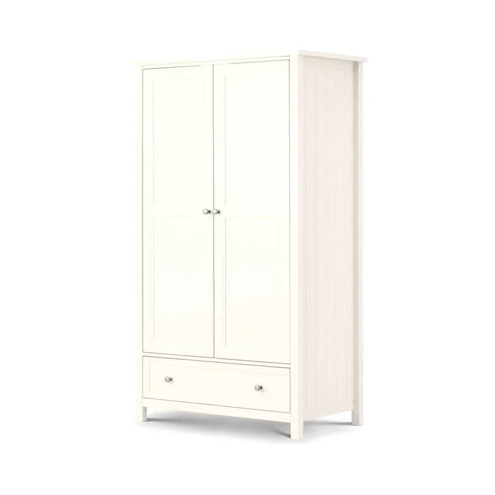 White wooden wardrobe with double doors and bottom storage drawer, photographed at an angle