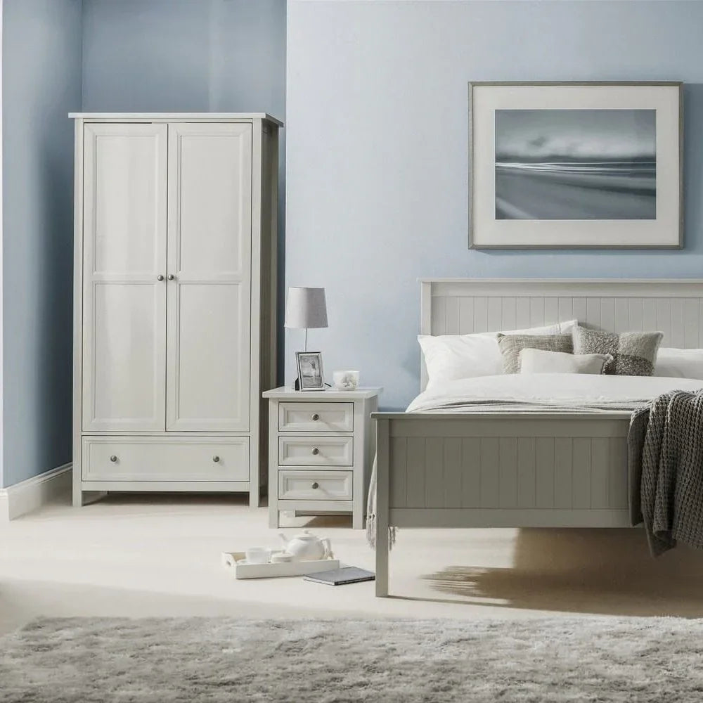 Grey bedroom furniture set with wardrobe, bedside table, and panel bed in light blue room