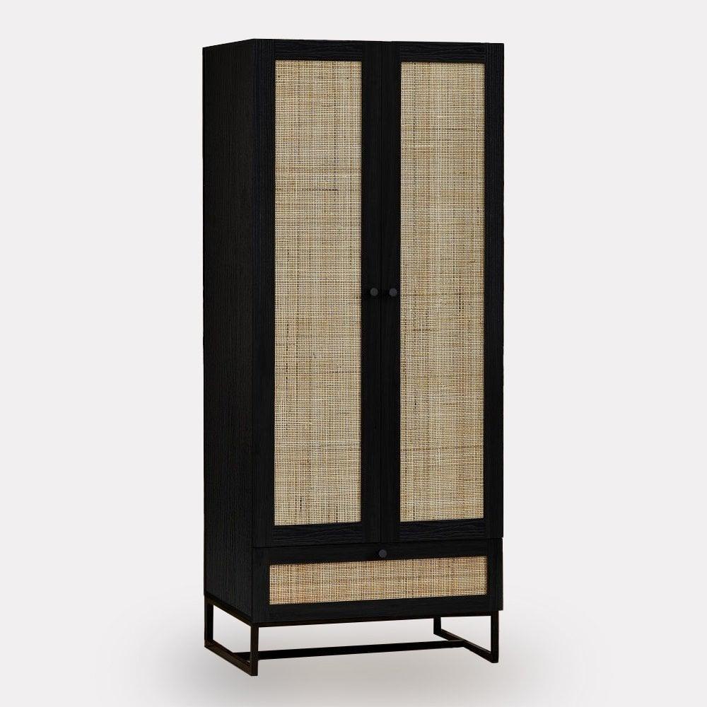 Black wood wardrobe with rattan panel doors and lower drawer on metal base