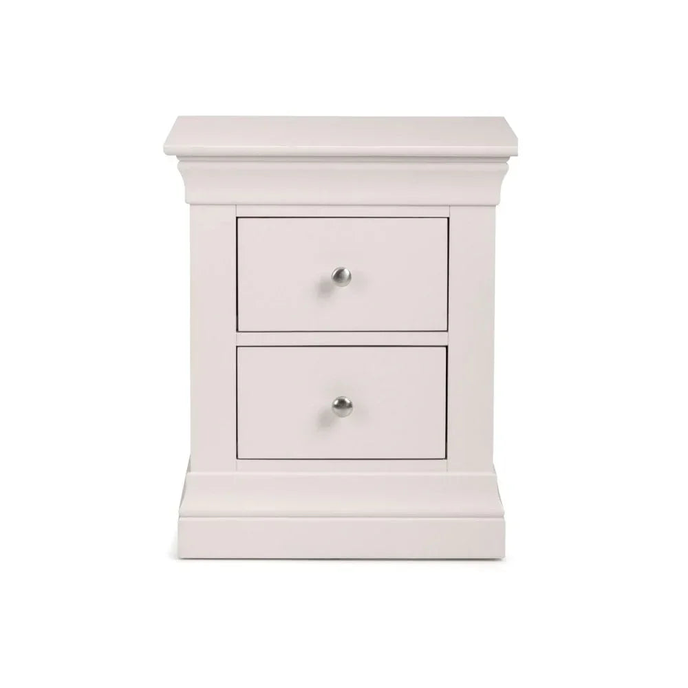 White bedside table with two drawers and silver handles, classic style front view