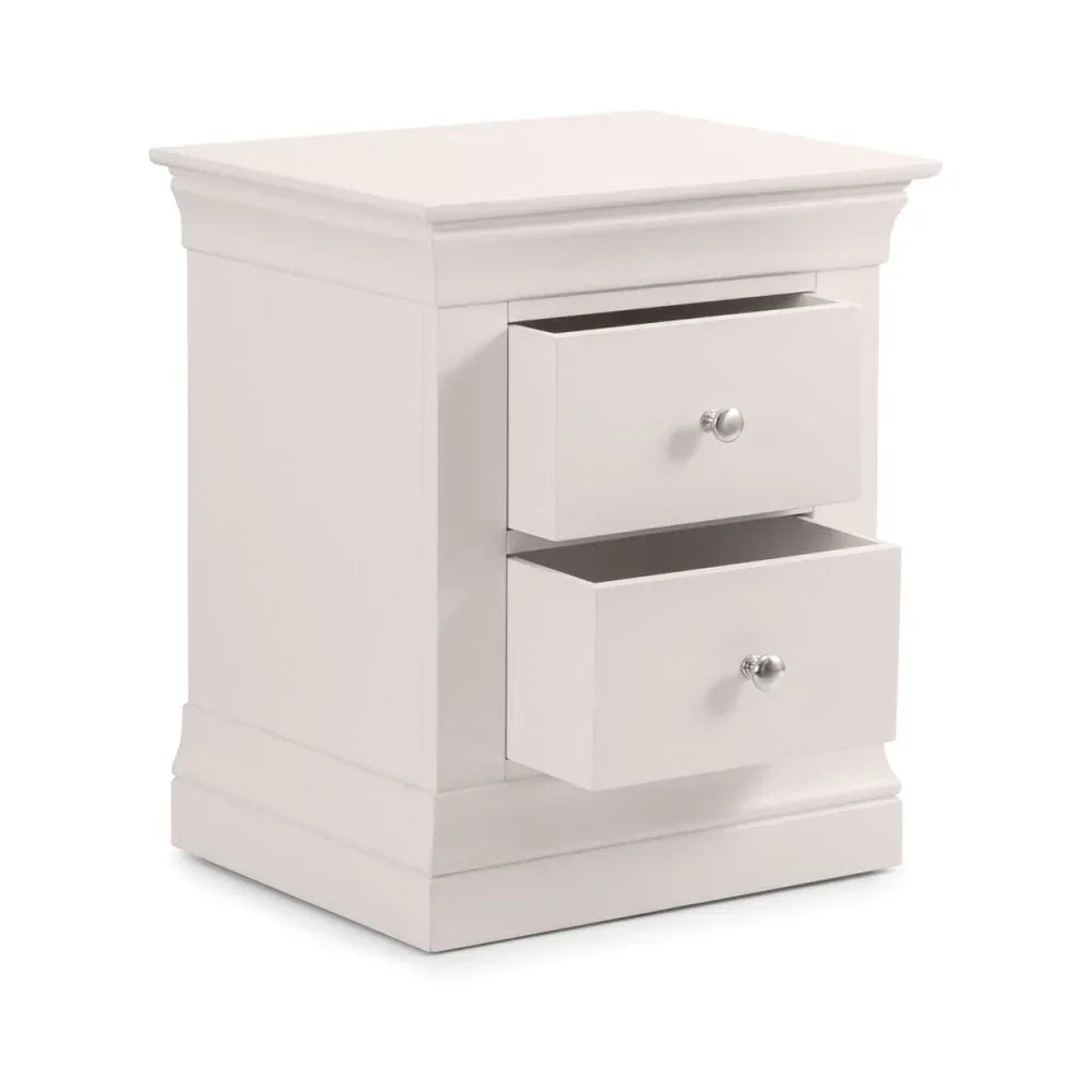 White bedside table with two open drawers and chrome handles, angled front view