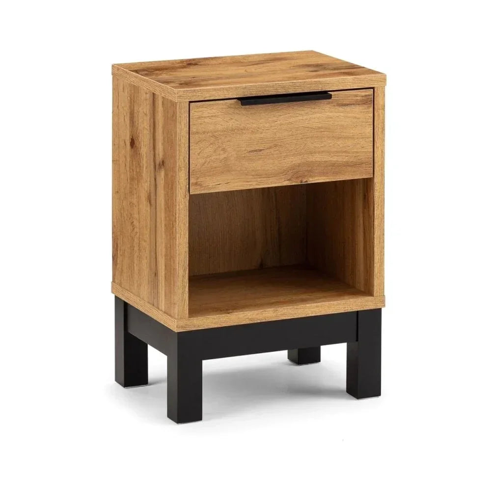 Oak bedside table with black legs, single drawer and open shelf, angled view