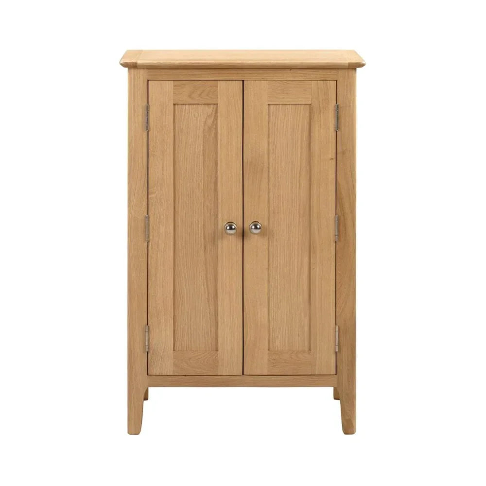 Oak cupboard with two panel doors and metal knobs, shown from front view