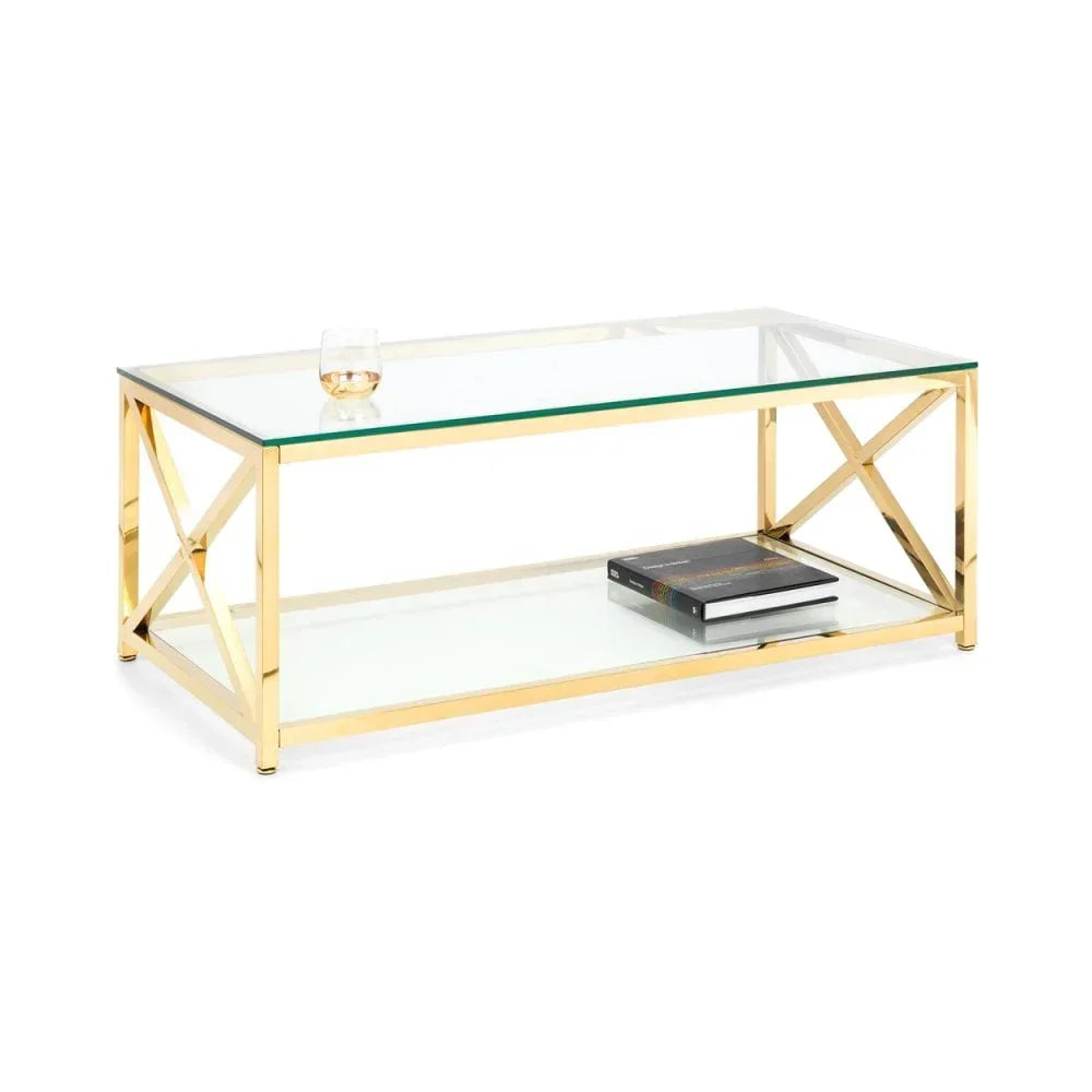 Glass coffee table with gold metal frame, lower shelf, book and glass on top