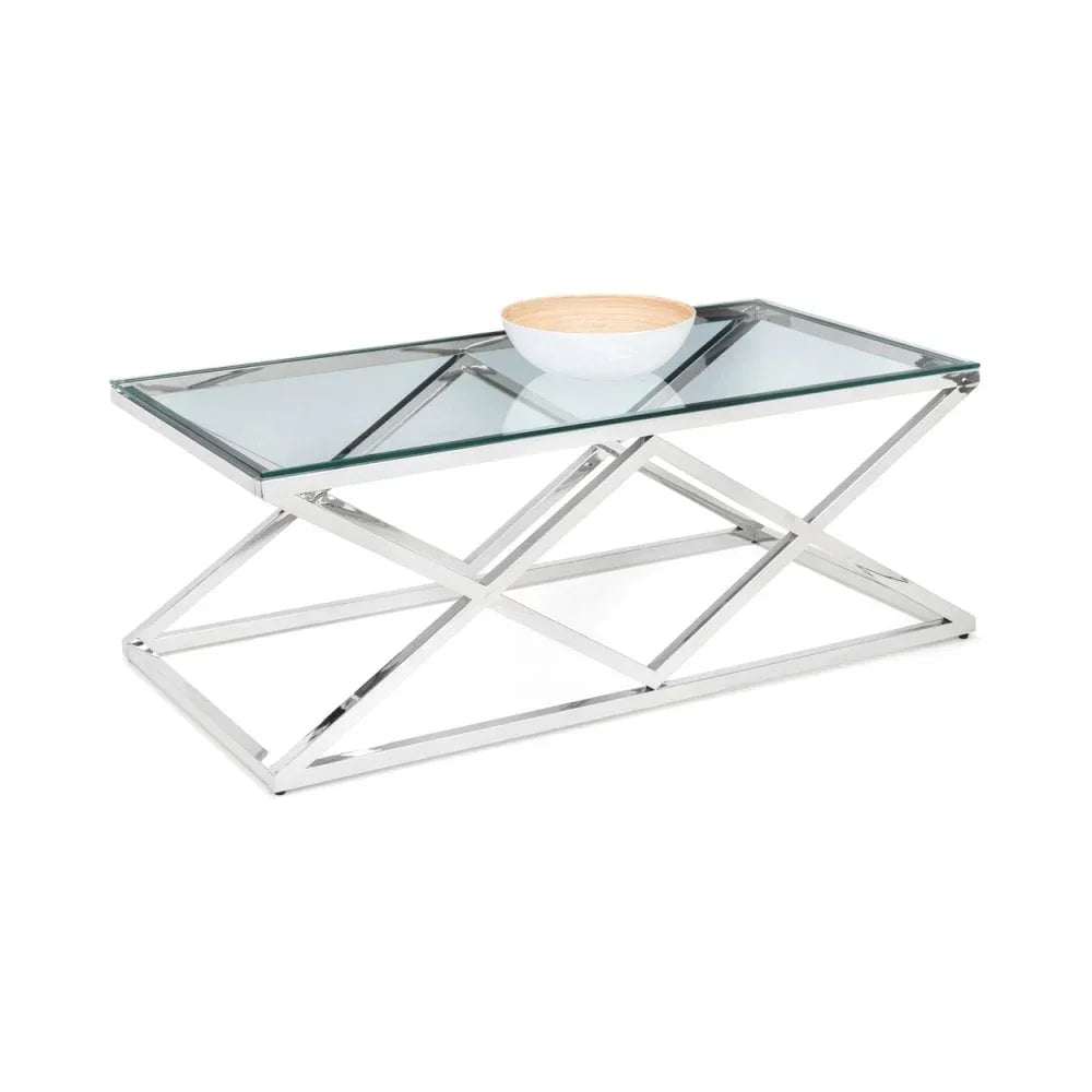 Glass top coffee table with chrome metal frame and decorative bowl on white background