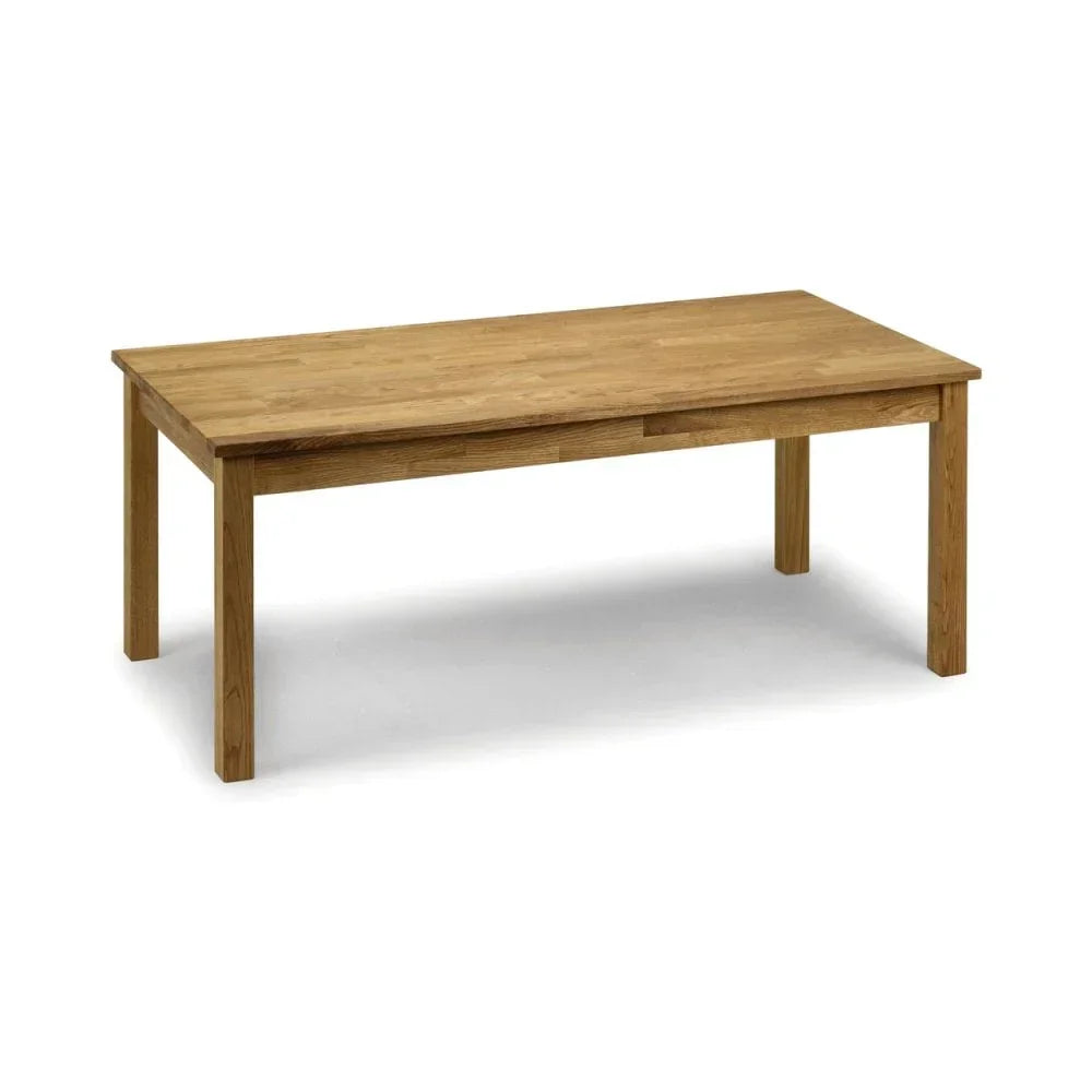 Rectangular oak dining table with four sturdy legs on white background