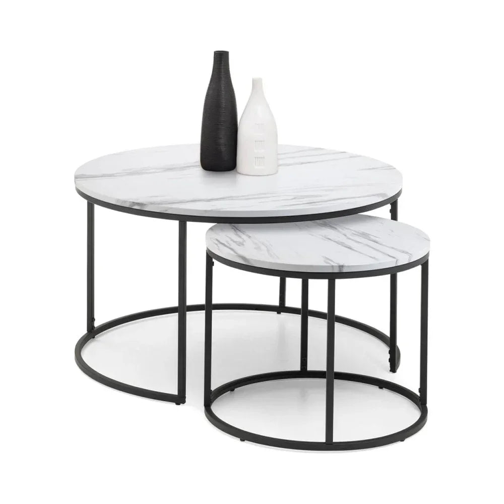 Round marble effect nesting coffee tables with black metal legs and decorative vases