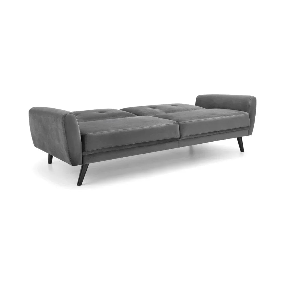 Grey fabric sofa bed with tufted seat, angled black legs, and low arms