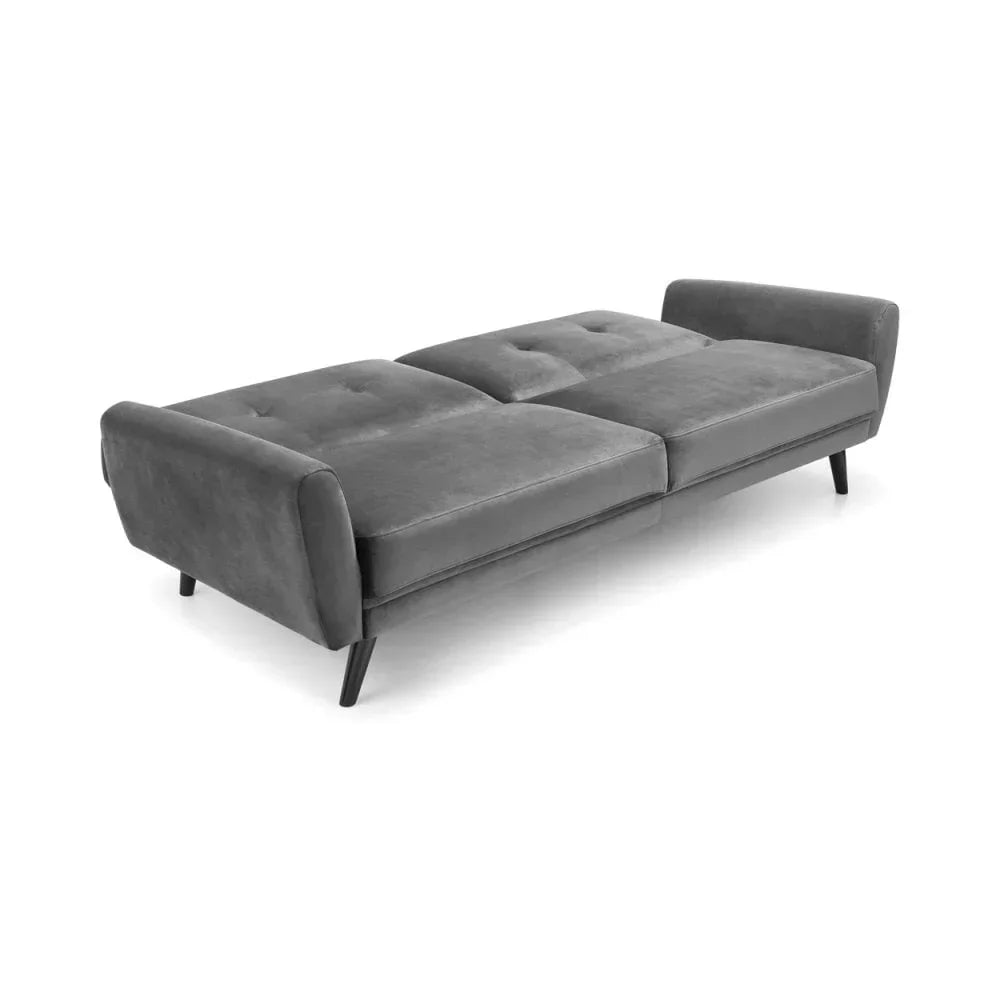 Grey velvet sofa bed with angled legs and reclining backrest in flat position