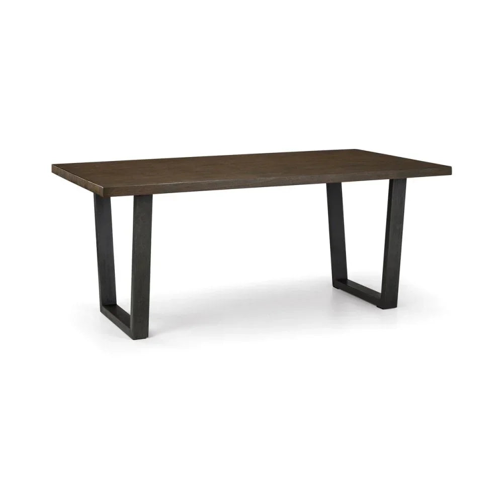 Rectangular wooden dining table with dark metal legs on white background