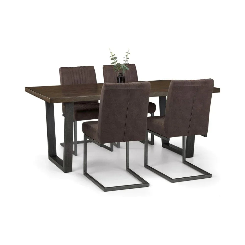 Dark wood dining table set with four brown upholstered chairs and metal legs