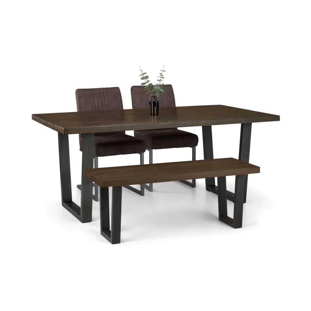 Dark wood dining table with metal legs, two upholstered chairs, and matching bench