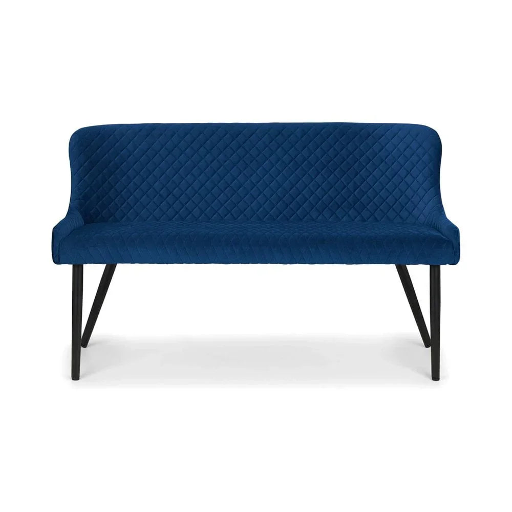 Blue velvet dining bench with quilted backrest and black metal legs, front view