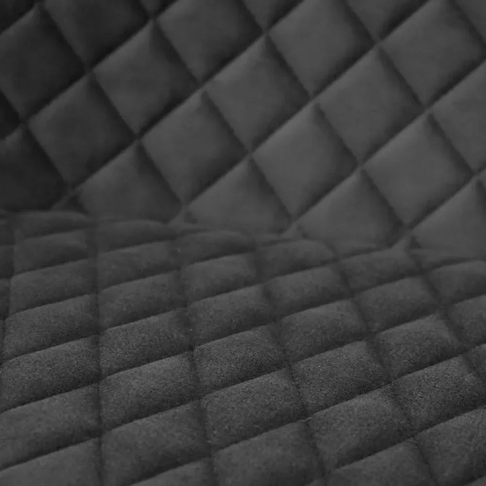 Quilted dark grey velvet upholstery fabric with diamond stitch detailing