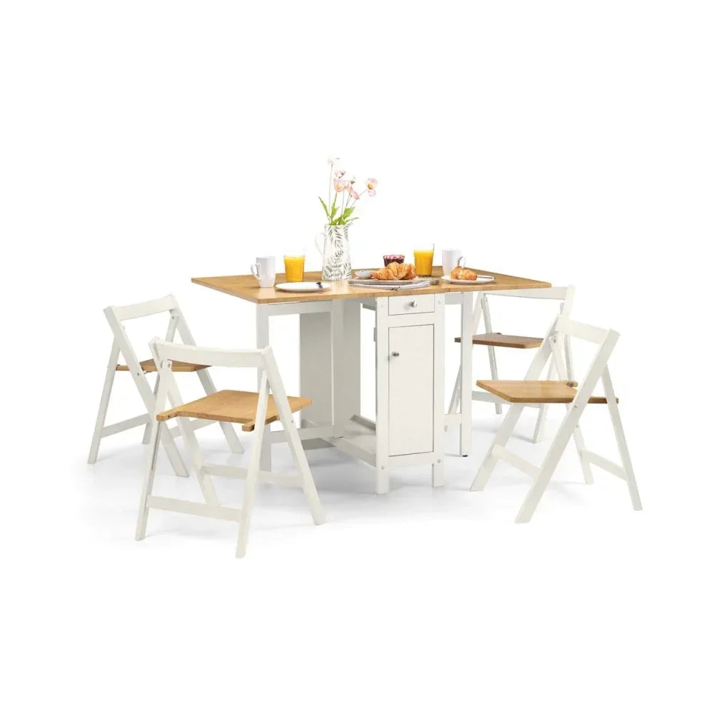 Compact white dining table set with drop-leaf design and four folding chairs