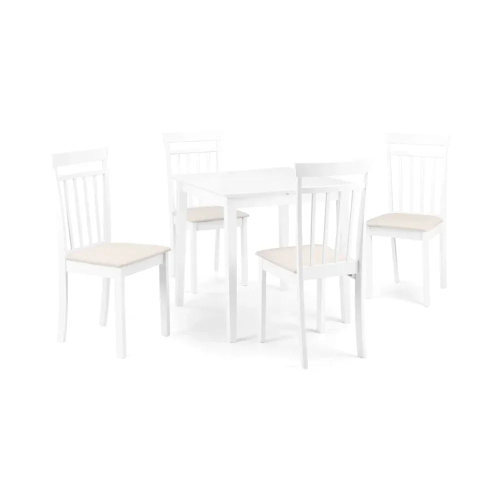 White dining table and four matching chairs with light cushioned seats