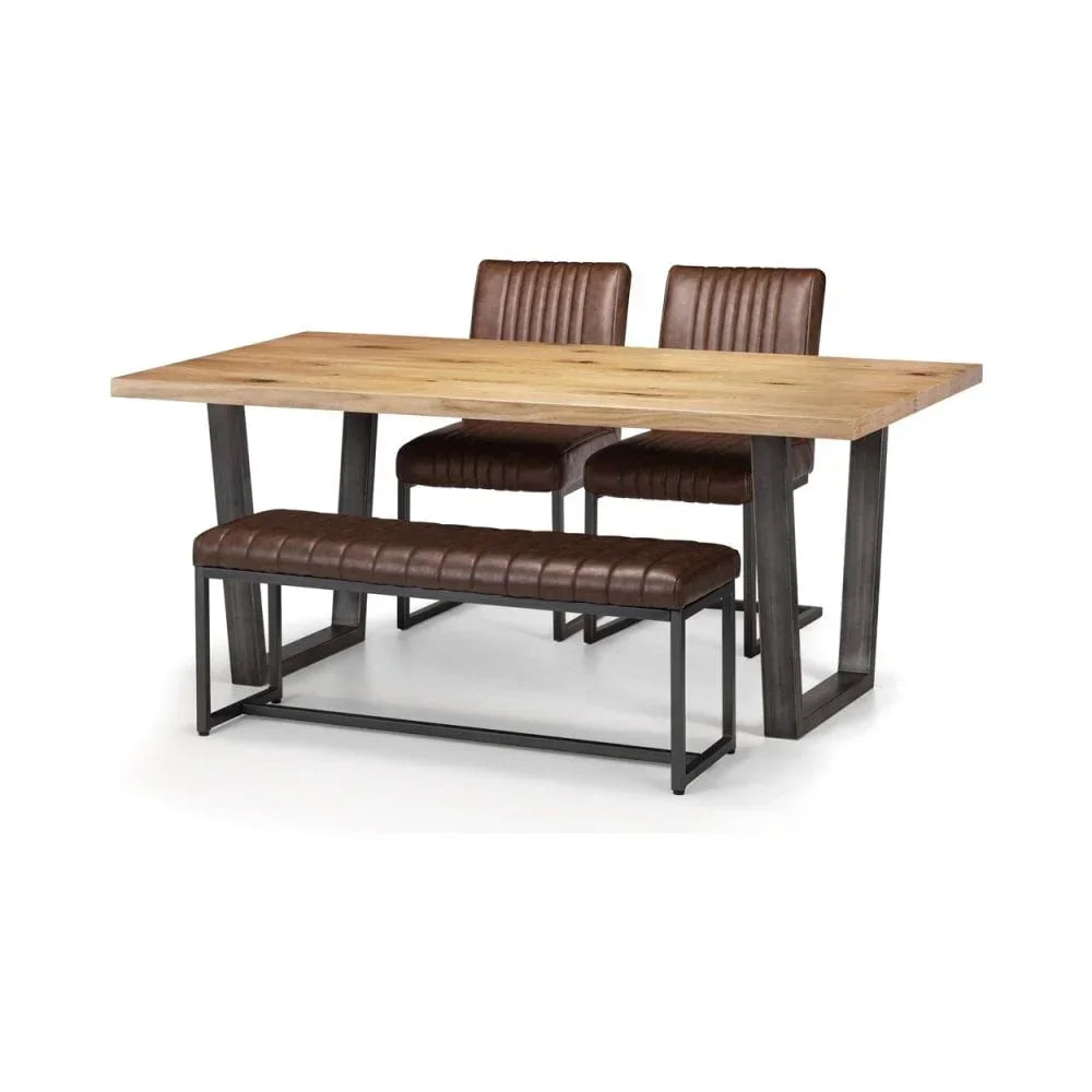 Industrial dining table set with wooden top, two brown chairs, and matching bench