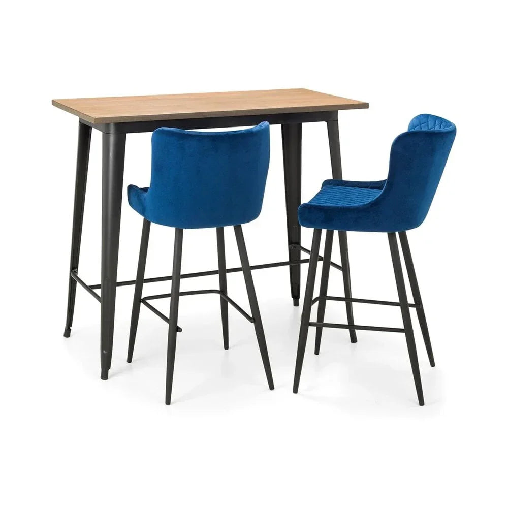 Bar table with light wood top and two blue velvet bar stools with black metal legs