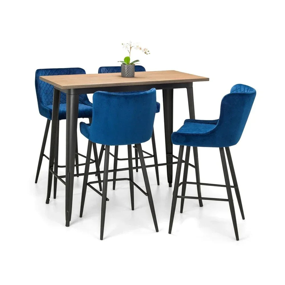 Blue velvet bar stools with black legs and wood dining table set, orchid plant centerpiece