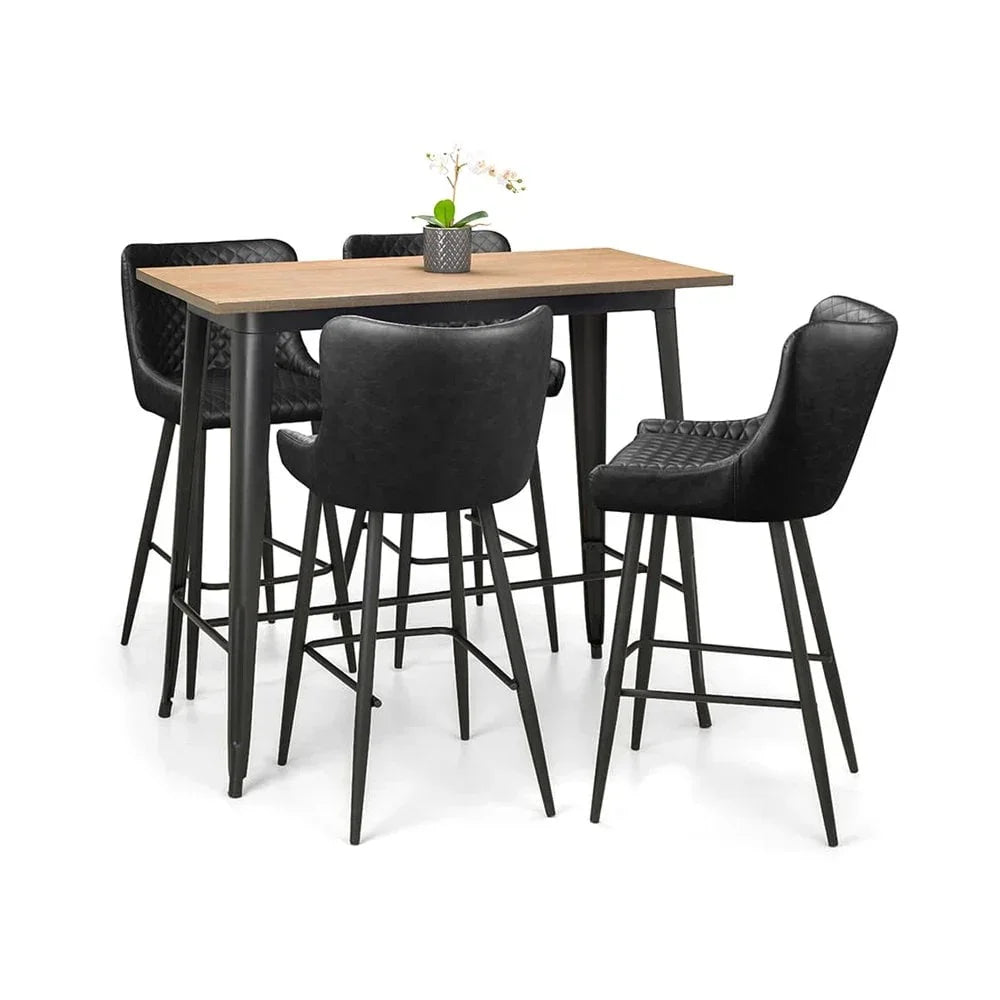 Bar table set with black quilted chairs and light wood top, small plant centerpiece