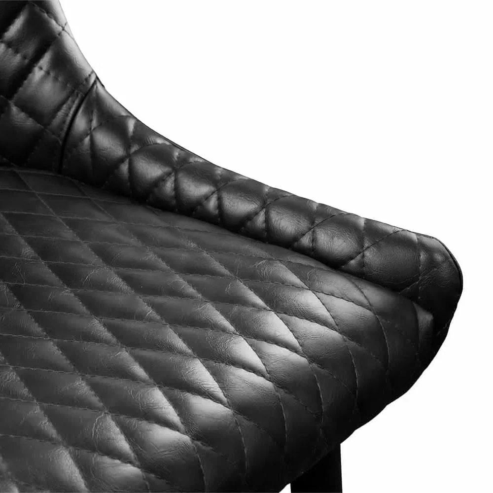 Close-up of black leather dining chair seat with diamond stitching detail