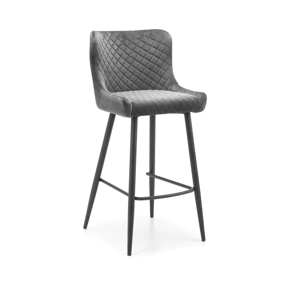 Grey velvet bar stool with diamond stitched backrest and black metal legs